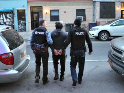 U.S. Immigration and Customs Enforcement (ICE), officers arrest an undocumented Mexican immigrant during a raid in the Bushwick neighborhood of Brooklyn on April 11, 2018 in New York City as part of "Operation Keep Safe." JOHN MOORE/GETTY