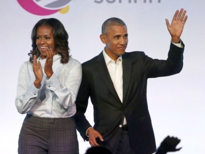 In this Oct. 31, 2017, file photo, former President Barack Obama, right, and former first lady Michelle Obama appear at the Obama Foundation Summit in Chicago. The Obamas have unveiled a slate of projects in development for Netflix, a year after the former president and first lady signed a deal …