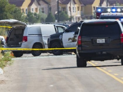 Odessa and Midland police and sheriff's deputies surround a white van in Odessa, Texas, Saturday, Aug. 31, 2019, after reports of gunfire. Police said there are "multiple gunshot victims" in West Texas after reports of gunfire on Saturday in the area of Midland and Odessa. (Tim Fischer/Midland Reporter-Telegram via AP)