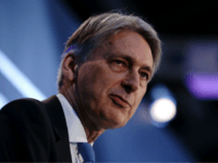 Britain's Chancellor of the Exchequer Philip Hammond speaks during the The International FinTech Conference 2018, in central London on March 22, 2018. / AFP PHOTO / POOL / Daniel LEAL-OLIVAS (Photo credit should read DANIEL LEAL-OLIVAS/AFP/Getty Images)