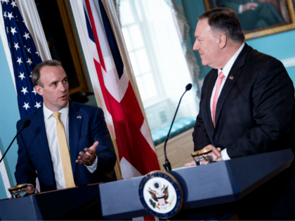 US Secretary of State Mike Pompeo (R) listens while British Foreign Secretary Dominic Raab speaks to reporters during a press conference at the US Department of State on August 7, 2019, in Washington, DC. (Photo by Brendan Smialowski / AFP) (Photo credit should read BRENDAN SMIALOWSKI/AFP/Getty Images)