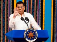 Philippine President Rodrigo Duterte gestures as he delivers his state of the nation address at Congress in Manila on July 22, 2019. (Photo by Noel CELIS / AFP) (Photo credit should read NOEL CELIS/AFP/Getty Images)