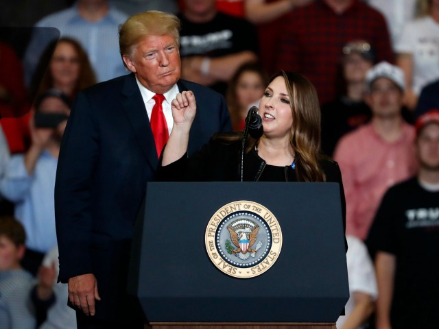 President Donald Trump listens as Chair of the Republican National Committee, Ronna McDaniel, right, speaks during a campaign rally Monday, Nov. 5, 2018, in Cape Girardeau, Mo. (AP Photo/Jeff Roberson)