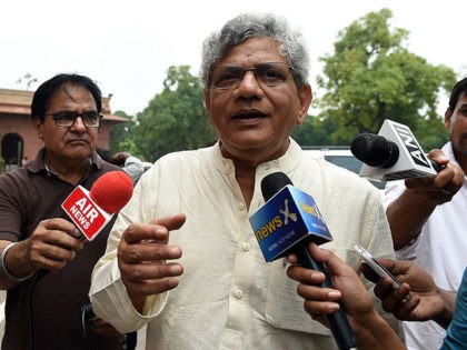 Communist Party of India (CPI) Leader Sitaram Yechury interacts with media representatives as he arrives at Parliament House in New Delhi on August 12, 2015. The NDA government led by Prime Minister Narendra Modi is attempting to guide the General Service Tax (GST) through parliament paving the way for a …