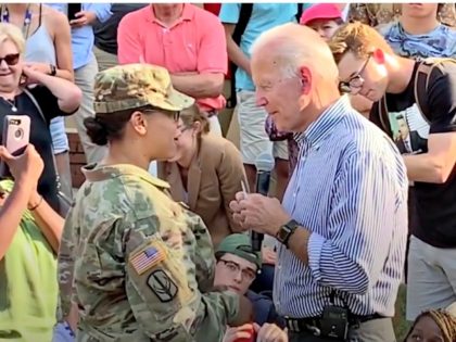 Soldier Gives Coin to Biden