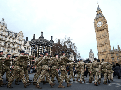 LONDON, ENGLAND - JANUARY 26: Military personnel march into the Houses of Parliament on January 26, 2015 in London, England. 120 military personnel from all three services were accompanied by the Band of the Grenadier Guards as they marched from Wellington Barracks to the Houses of Parliament. The march was …