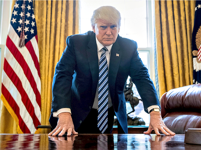 In this April 21, 2017, file photo, President Donald Trump poses for a portrait in the Oval Office in Washington after an interview with The Associated Press.Andrew Harnik / AP