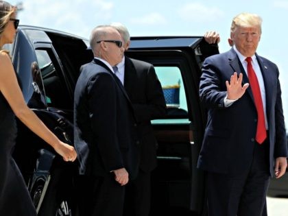 President Donald Trump and first lady Melania Trump, left, arrive to board Air Force One at Wright-Patterson Air Force Base after meeting with people affected by the mass shooting in Dayton, Ohio, Wednesday, Aug. 7, 2019, at Wright-Patterson Air Force Base, Ohio. (AP Photo/Evan Vucci)