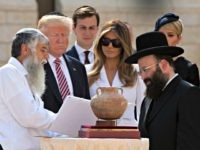 US President Donald Trump (2nd L), senior advisor Jared Kushner (3rd L), first lady Melania Trump (C) and Ivanka Trump, the president's daughter, listens to Rabbi Shmuel Rabinovitch (R) during a visit to the Western Wall, the holiest site where Jews can pray, in Jerusalems Old City on May 22, …