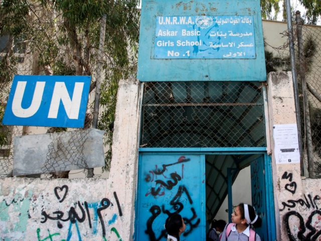 Palestinian girls exit from a school run by the United nations Relief and Works Agency's (UNRWA, UN agency for Palestinian refugees), in the Askar refugee camp east of Nablus in the occupied West Bank on September 2, 2018. - The United States, the biggest contributor to the UNRWA -- a …