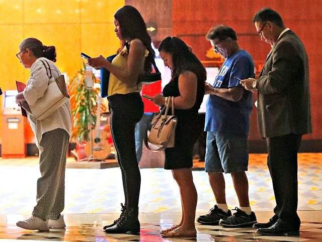 Job applicants wait in line at the Seminole Hard Rock Hotel & Casino Hollywood during