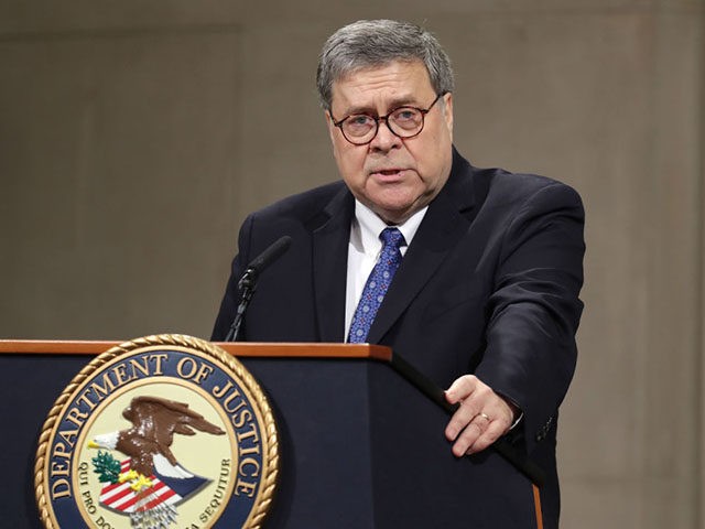 WASHINGTON, DC - MAY 09: U.S. Attorney General William Barr delivers remarks during a farewell ceremony for Deputy Attorney General Rod Rosenstein at the Robert F. Kennedy Main Justice Building May 09, 2019 in Washington, DC. Rosenstein, who has worked for the federal government for more than 29 years, will …