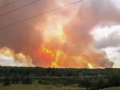 TOPSHOT - This screen grab from a video made on August 5, 2019 shows explosions at an ammunition depot near the town of Achinsk in the Krasnoyarsk region. - Up to eight people were injured and thousands were evacuated on August 5, 2019 because of a fire at a Siberian …