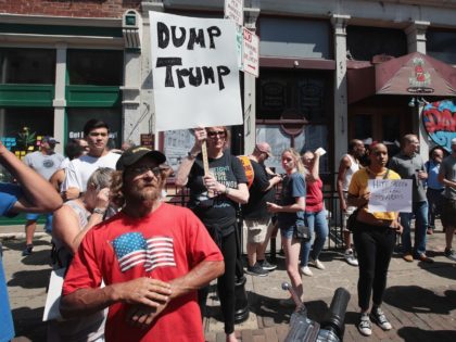 DAYTON, OHIO - AUGUST 07: Pro and anti-Trump demonstrators protest in the Oregon District, where a mass shooting early Sunday morning left nine dead and 27 wounded, on August 07, 2019 in Dayton, Ohio. President Donald Trump visited the city today to offer his support to the community but did …