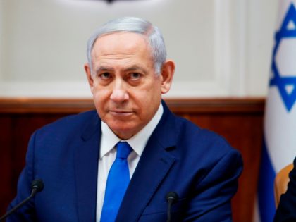 Israeli Prime Minister Benjamin Netanyahu attends the weekly cabinet meeting in Jerusalem on July 14, 2019. - Netanyahu today warned the head of Lebanon's Tehran-backed Hezbollah that "crushing" retaliation would follow any attack after its leader said the group's rockets could reach Tel Aviv. (Photo by RONEN ZVULUN / POOL …