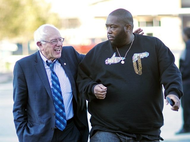Democratic presidential candidate Sen. Bernie Sanders, I-Vt. left, walks in with rapper Killer Mike for a visit to The Busy Bee Cafe Monday, Nov. 23, 2015, in Atlanta. (AP Photo/David Goldman)