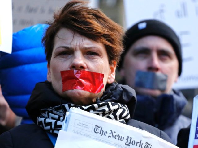 People take part in a protest outside the New York Times on February 26, 2017 in New York. The White House denied access Frebuary 24. 2017 to an off-camera briefing to several major US media outlets, including CNN and The New York Times. Smaller outlets that have provided favorable coverage …