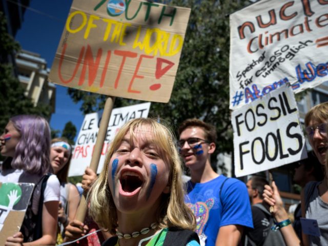 outh climate activists demonstrate at the end of the "Smile for Future Summit for climate" that gathered during a week more than 450 young climate strike activists from 37 European countries to reflect on the future of their global movement, on August 9, 2019 in Lausanne. (Photo by FABRICE COFFRINI …