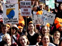 AUCKLAND, NEW ZEALAND - MAY 24: School children march down Queen Street during a climate change protest on May 24, 2019 in Auckland, New Zealand. Thousands of students across New Zealand are demonstrating in the streets again to fight for climate change action. (Photo by Hannah Peters/Getty Images)