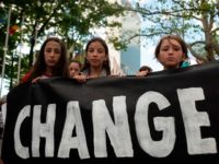 climate protesters with banner