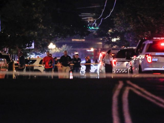 Authorities work the scene of a mass shooting, Sunday, Aug. 4, 2019, in Dayton, Ohio. A se