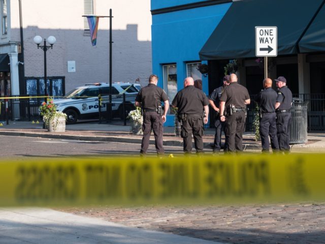 Police gather after an active shooter opened fire in the Oregon district in Dayton, Ohio on August 4, 2019. - Nine people were killed in a mass shooting early Sunday in Dayton, Ohio, police said, adding that the assailant was shot dead by responding officers.The incident occurred shortly after 1:00 …