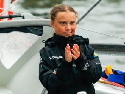 Swedish climate activist Greta Thunberg, 16, and father Svante Thunberg arrive in the US after a 15-day journey crossing the Atlantic in the Malizia II, a zero-carbon yacht, on August 28, 2019 in New York. - "Land!! The lights of Long Island and New York City ahead," she tweeted early …