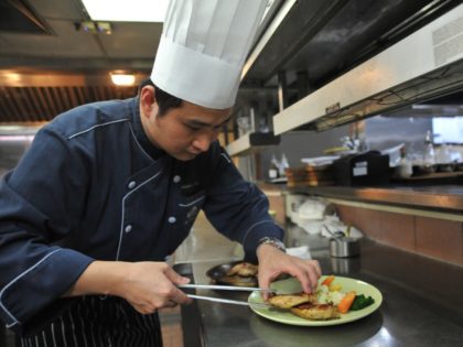 This photo taken on January 19, 2018 shows a chef preparing a Halal meal at the Gaia Hotel, which caters to tourists from Muslim-dominant countries, in the Beitou district near Taipei. From halal fried chicken to hot springs hotels with prayer facilities, Taiwan is adapting its traditional tourist draws to …
