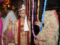 Kashmiri groom and bride in traditional attire walk their "Yanivol" or wedding day in Srinagar part of Indian-controlled Kashmir on September 25, 2010. Wedding functions, traditionally ostentatious ceremonies that run for many days, have been affected by clashes between stone-throwing crowds and security forces that have killed 107 civilians following …
