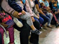 Carolyn Van Houten/The Washington Post via Getty Images Recently detained migrants, many of them family units, sit and await processing in the US Border Patrol Central Processing Center in McAllen, Texas on August 12, 2019.
