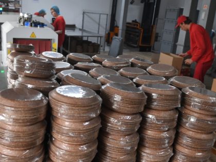 Employees work at the Biotrem factory producing wheat bran plates in Zambrow, Poland, on May 29, 2019. - Biotrem distributes the plates in Europe, Asia, North America and Australia and is hoping to expand its offer to edible boxes for takeaway meals and catering. The research is already at a …