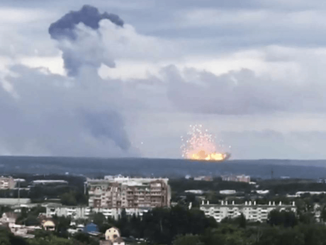 In this image taken from video, explosions are seen at the military base, about 10 kilometers from Achinsk, Krasnoyarsk region, Russia Far East, Monday, Aug. 5, 2019. An explosion at a Russian military base in Siberia has set off fires and injured at several people. (Liza Uskova via AP)