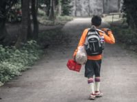 young boy walking