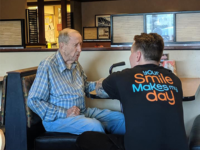 A sweet story behind images of an elderly man and his waiter is being shared by thousands