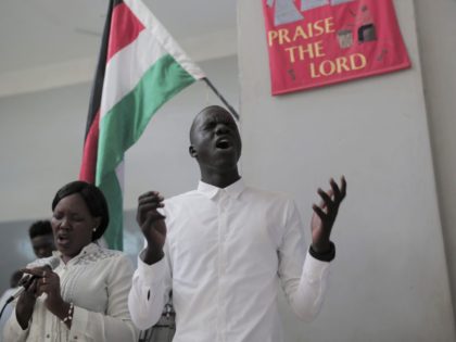 Members of Sudan's All Saints Cathedral choir sing during a service in the capital Khartoum on August 18, 2019. - Sudan's Christians suffered decades of persecution under the regime of Islamist general Omar al-Bashir. Now they hope his downfall will give the religious freedom they have long prayed for. (Photo …