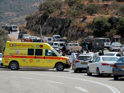 Israeli security forces gather at the site where a bomb exploded near the Israeli settleme