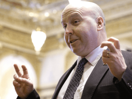 Illinois Sen. Thomas Cullerton, D-Villa Park, speaks to reporter while on the Senate floor during session Thursday, March 17, 2016, in Springfield, Il. Illinois' overdue bills are actually 16 percent higher than previously reported and could top $10 billion by end of the fiscal year. (AP Photo/Seth Perlman)