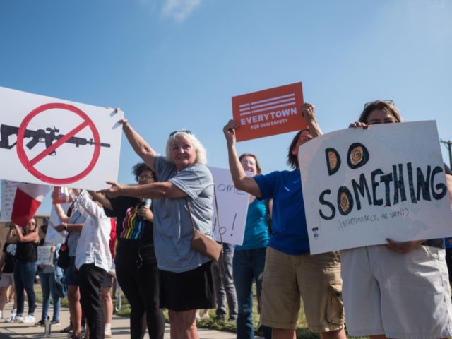 Demonstrators protest the visit of US President Donald Trump to the site of the mass shooting in Dayton, Ohio, on August 7, 2019. - Nine people were killed on August 4 in the city's popular Oregon District. (Photo by Megan JELINGER / AFP) (Photo credit should read MEGAN JELINGER/AFP/Getty Images)