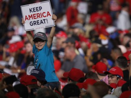 MANCHESTER, NEW HAMPSHIRE - AUGUST 15: People cheer as President Donald Trump prepares to speak to supporters at a rally in Manchester on August 15, 2019 in Manchester, New Hampshire. The Trump 2020 campaign is looking to flip the battleground state of New Hampshire with the use of a strong …