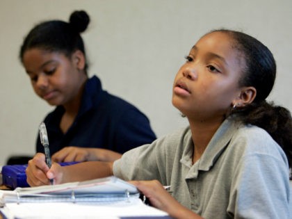 London McCoy, 10, right, and Jaclyn Williams, 10, do homework during their study hall session at View Park Prep Charter School Tuesday, Oct. 11, 2005, in South Los Angeles. Specialty schools that shun many of the methods of traditional public schools are no longer just the purview of privileged suburban …