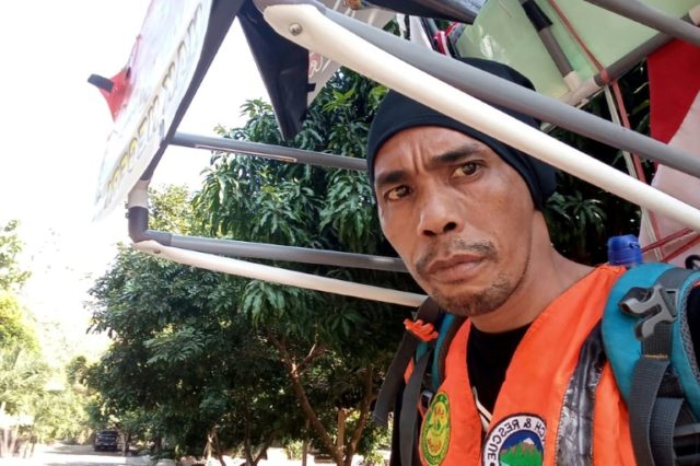 Indonesian man walking in reverse to save forests