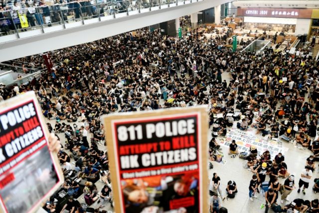 'An eye for an eye': sea of black at Hong Kong airport protest