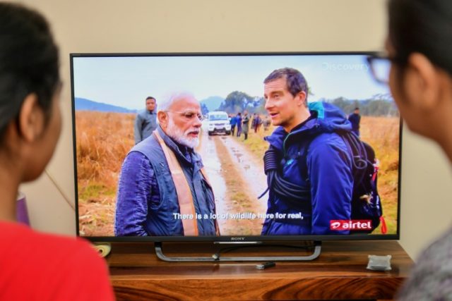 India's Modi bears all, sniffs dung with Grylls