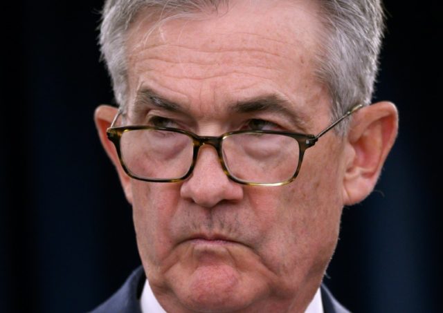 Asian markets drop as traders await Powell speech