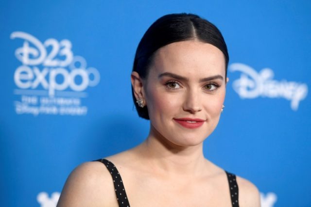 A brief clip from the upcoming film "Star Wars: Rise of Skywalker" appeared to show a darker version of heroine Rey (Daisy Ridley) wielding a red, double-sided lightsaber 'Star Wars' and 'Frozen 2' footage wows Disney fan fest
