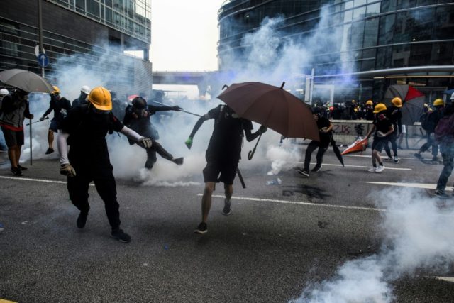 Hong Kong police threaten use of water cannon in latest clashes