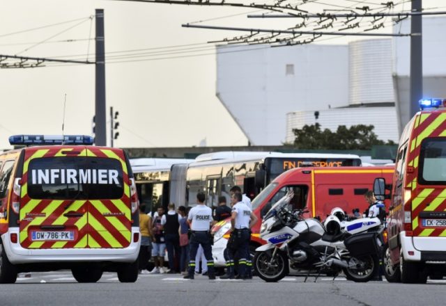 Emergency services are at work in Villeurbanne on the outskirts of Lyon, south-eastern France, after a knife attack One dead, nine wounded in French knife attack