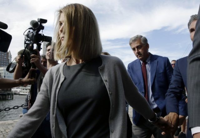 APTOPIX College Admissions Bribery Lori Laughlin, Mossimo Giannulli Lori Loughlin departs federal court Tuesday, Aug. 27, 2019, in Boston, after a hearing in a nationwide college admissions bribery scandal. At far right is her husband, clothing designer Mossimo Giannulli. (AP Photo/Steven Senne) The Associated Press