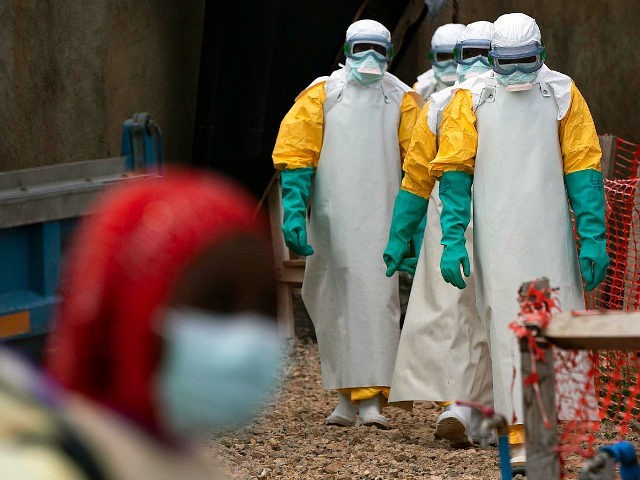 In this Tuesday, July 16, 2019 photo, health workers dressed in protective gear begin their shift at an Ebola treatment center in Beni, Congo DRC. The World Health Organization has declared the Ebola outbreak an international emergency after spreading to eastern Congo's biggest city, Goma, this week. More than 1,600 …
