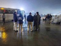ICE ERO officers prepare to board a group of migrants on a charter removal flight. (File Photo: U.S. Immigration and Customs Enforcement/Enforcement and Removal Operations)